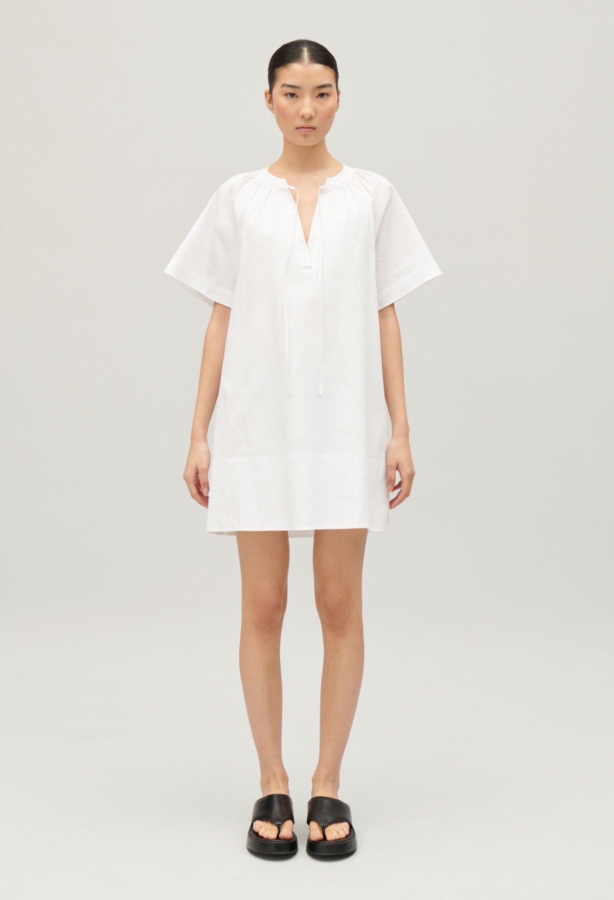Short white lace-up dress