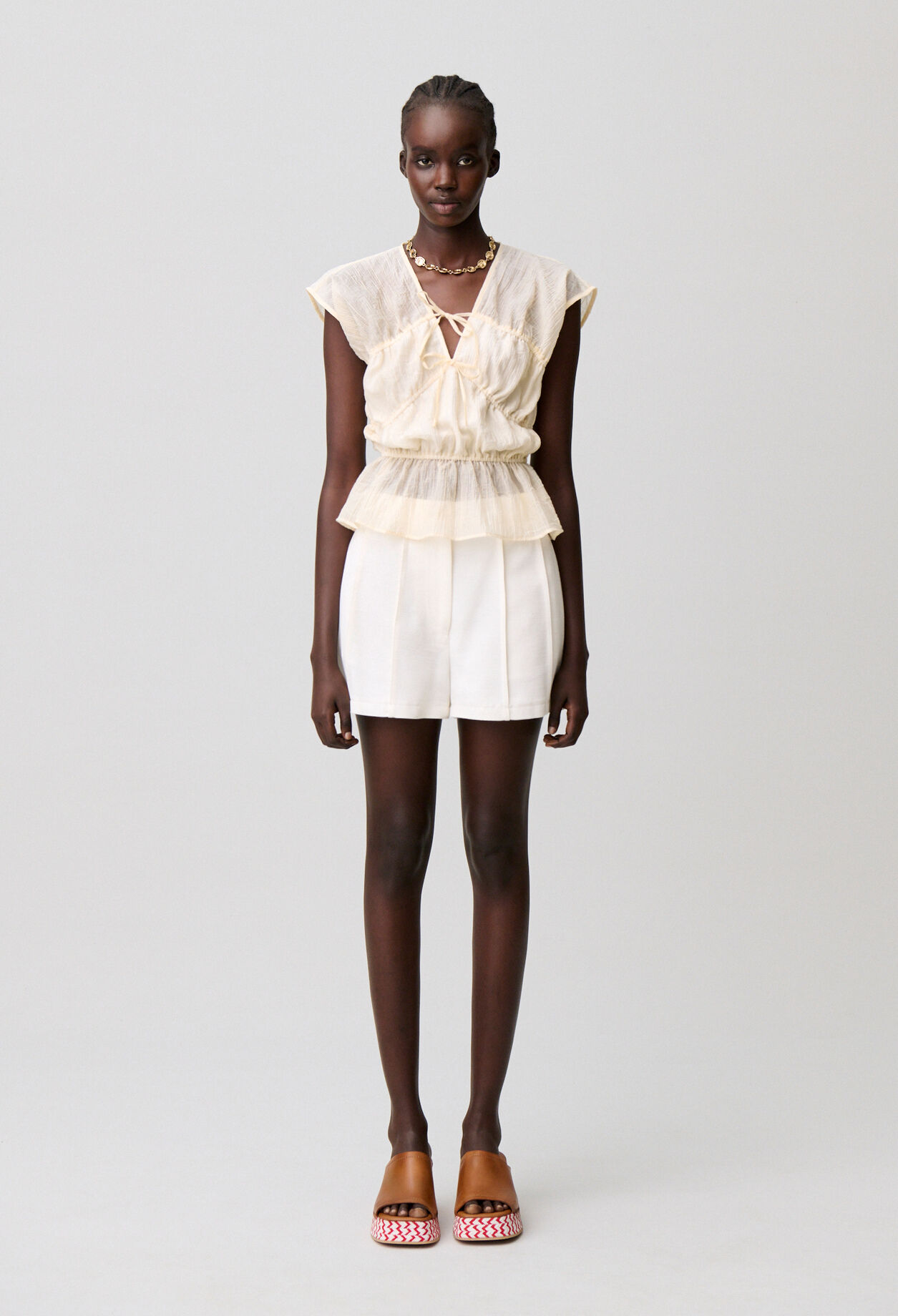 Short surpiqu&eacute; couture