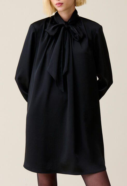 Flowing dress with black bow collar