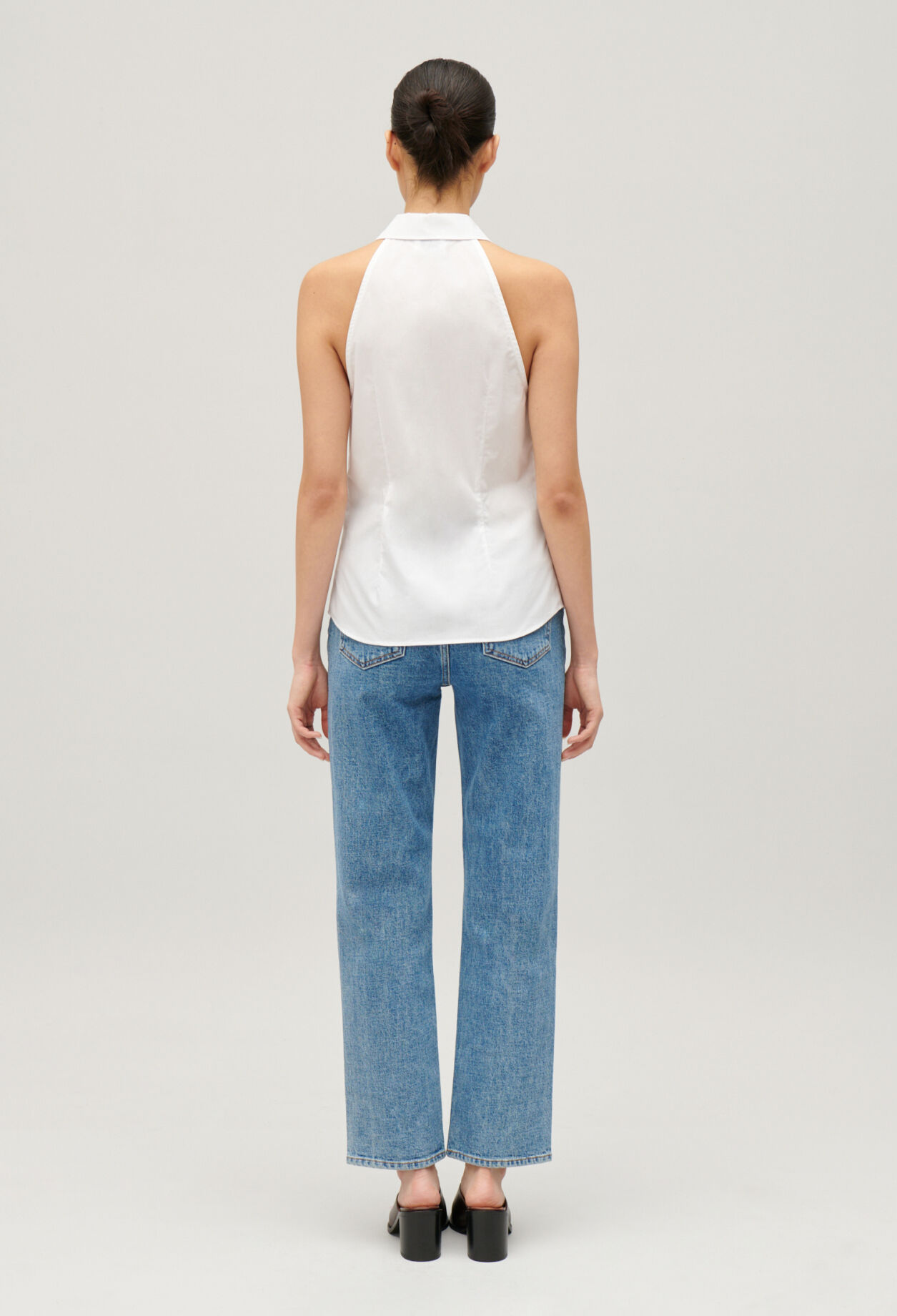 Sleeveless white shirt