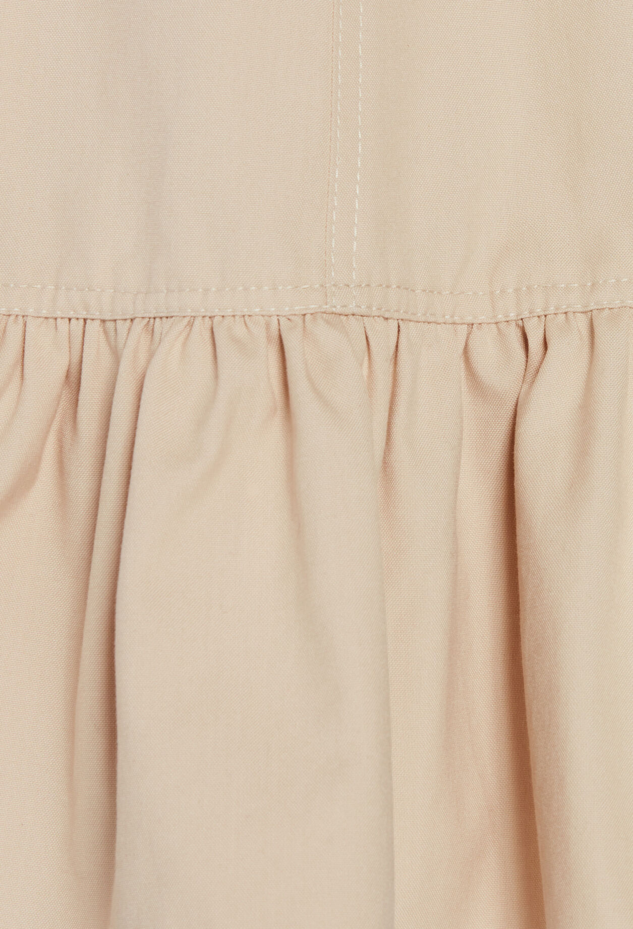 Short beige dress with ruffled sleeves