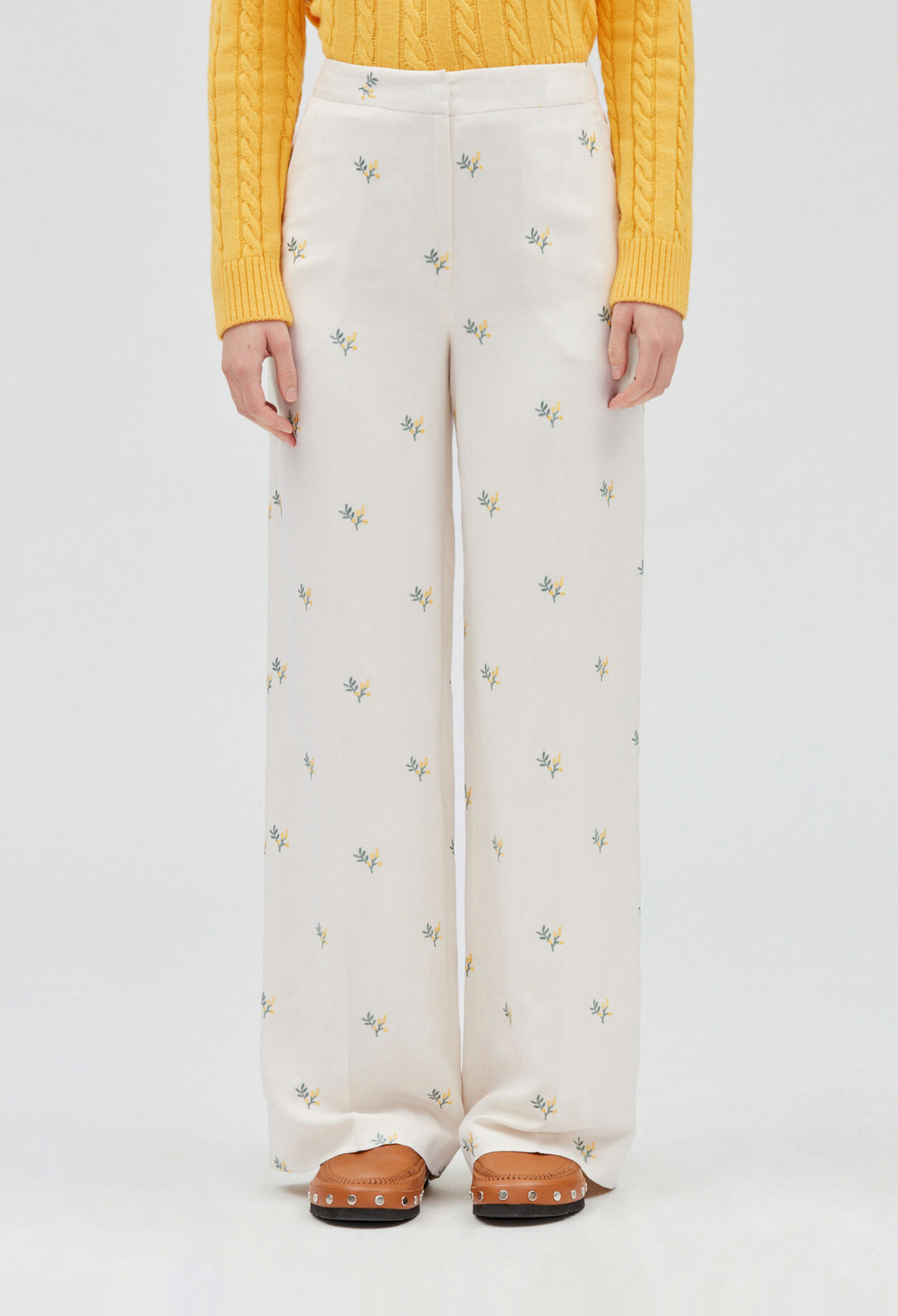 Trousers with embroidered mimosa pattern