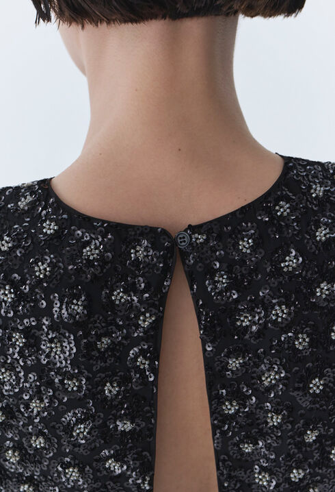 Top noir sequins brodés dos ouvert