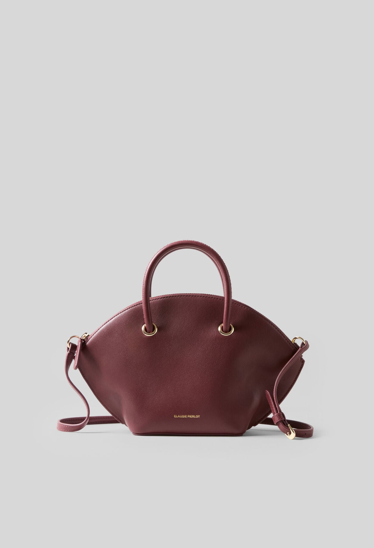 Glattledertasche mit Goldringen