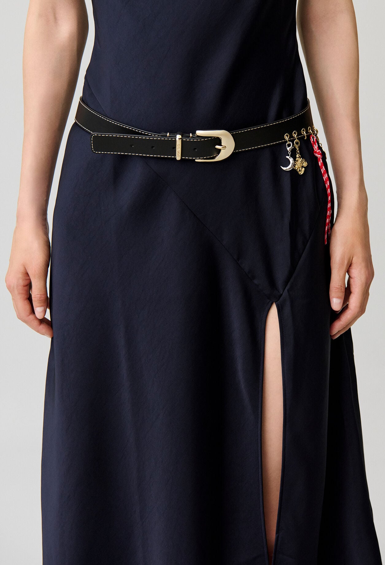 Leather eyelet belt with charms