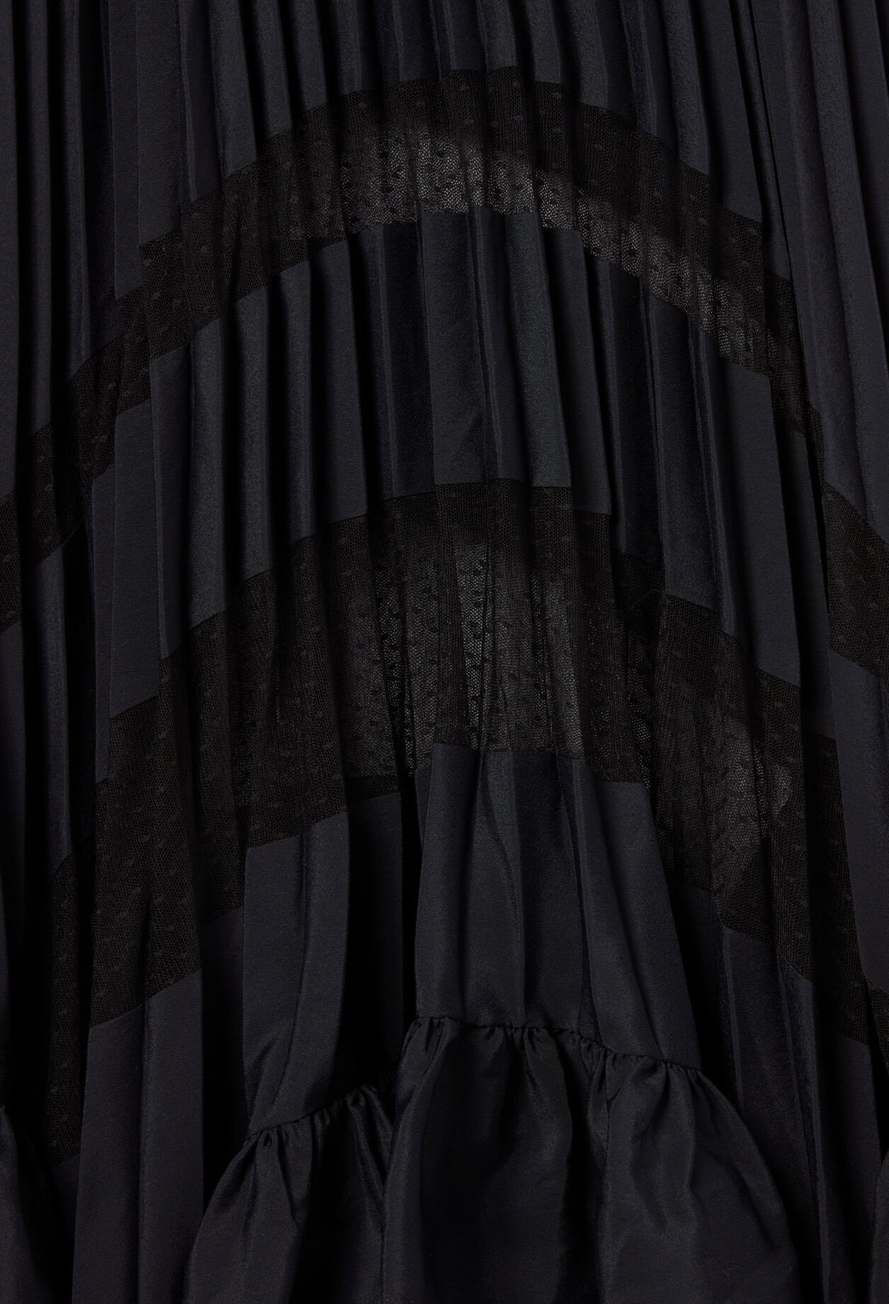 Jupe midi plissée et asymétrique