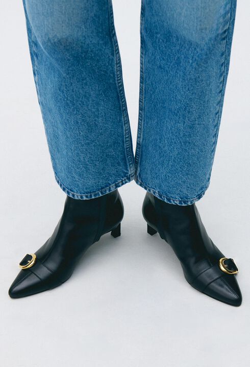 Gold buckle leather ankle boots