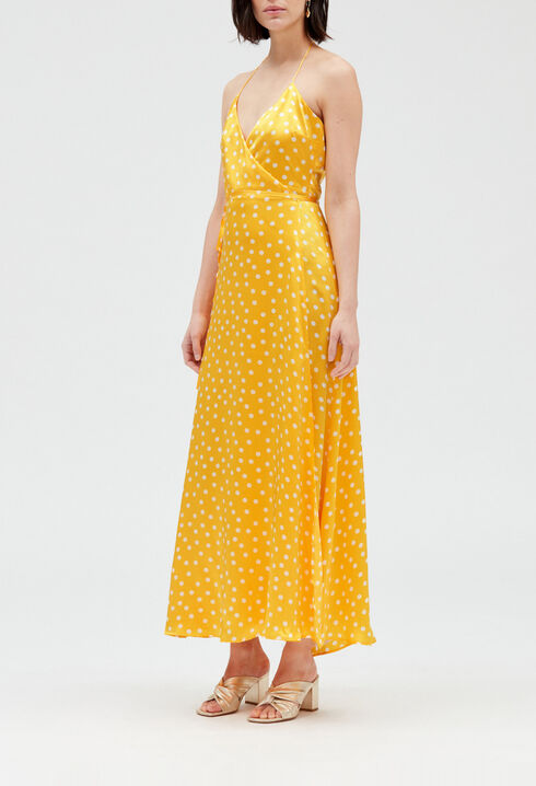 Long yellow silk wraparound dress.
