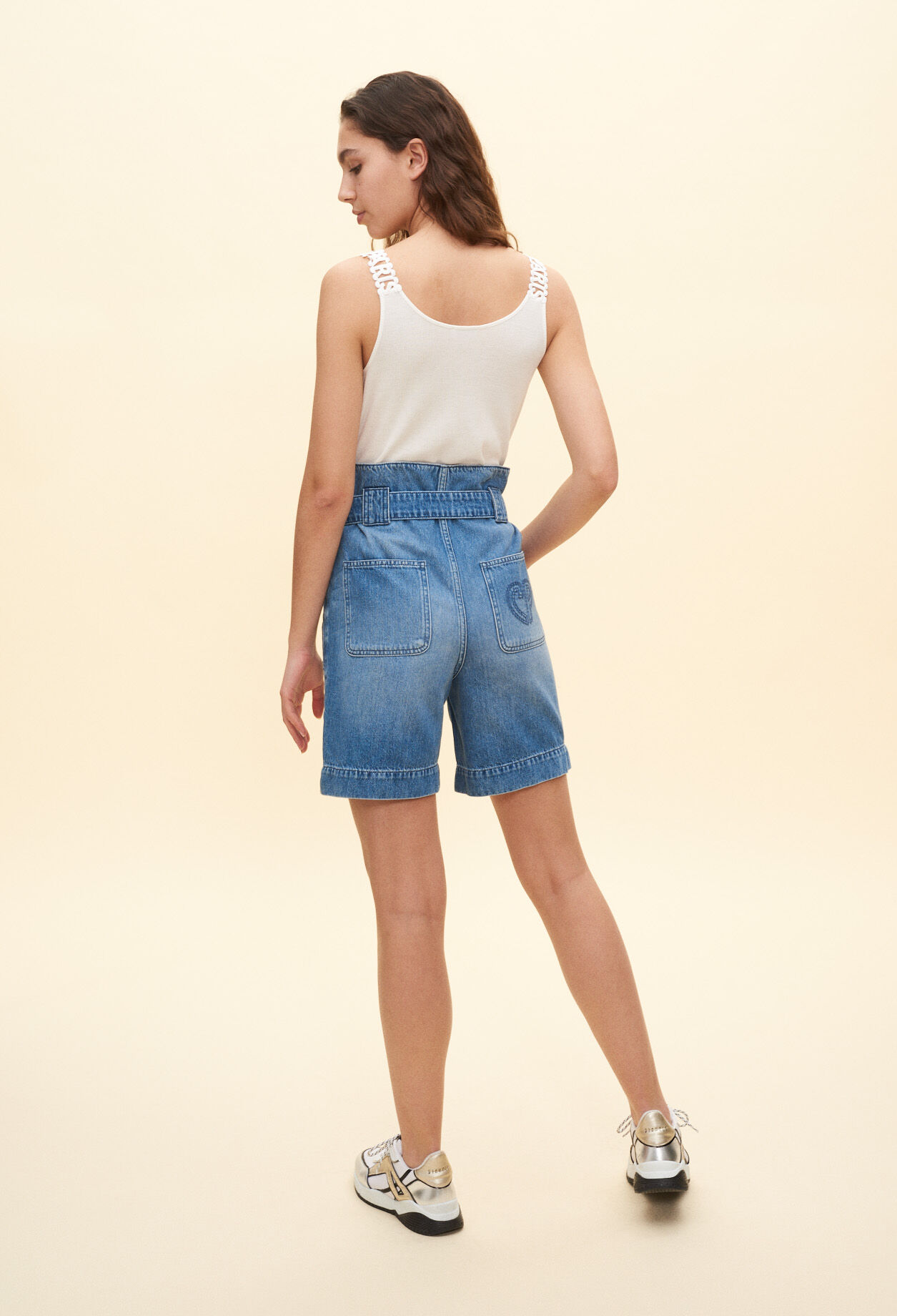 Vest with decorative straps