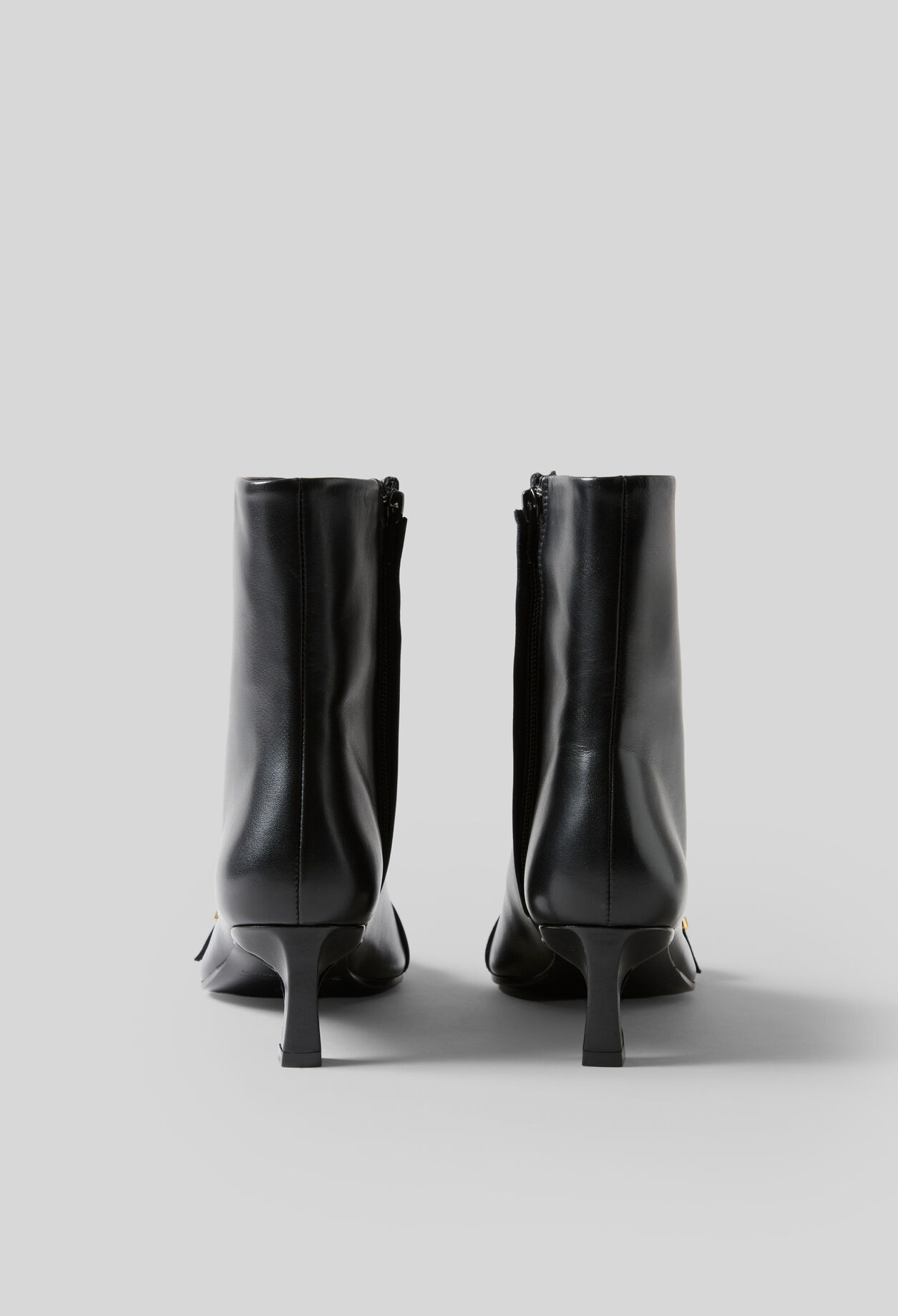 Gold buckle leather ankle boots
