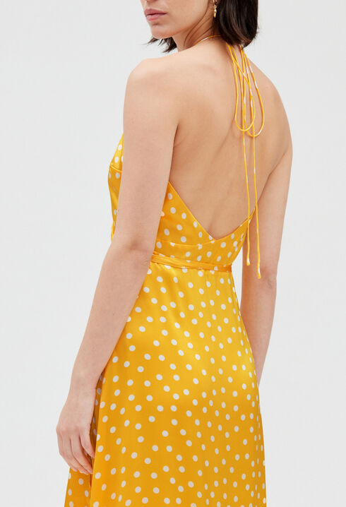 Long yellow silk wraparound dress.