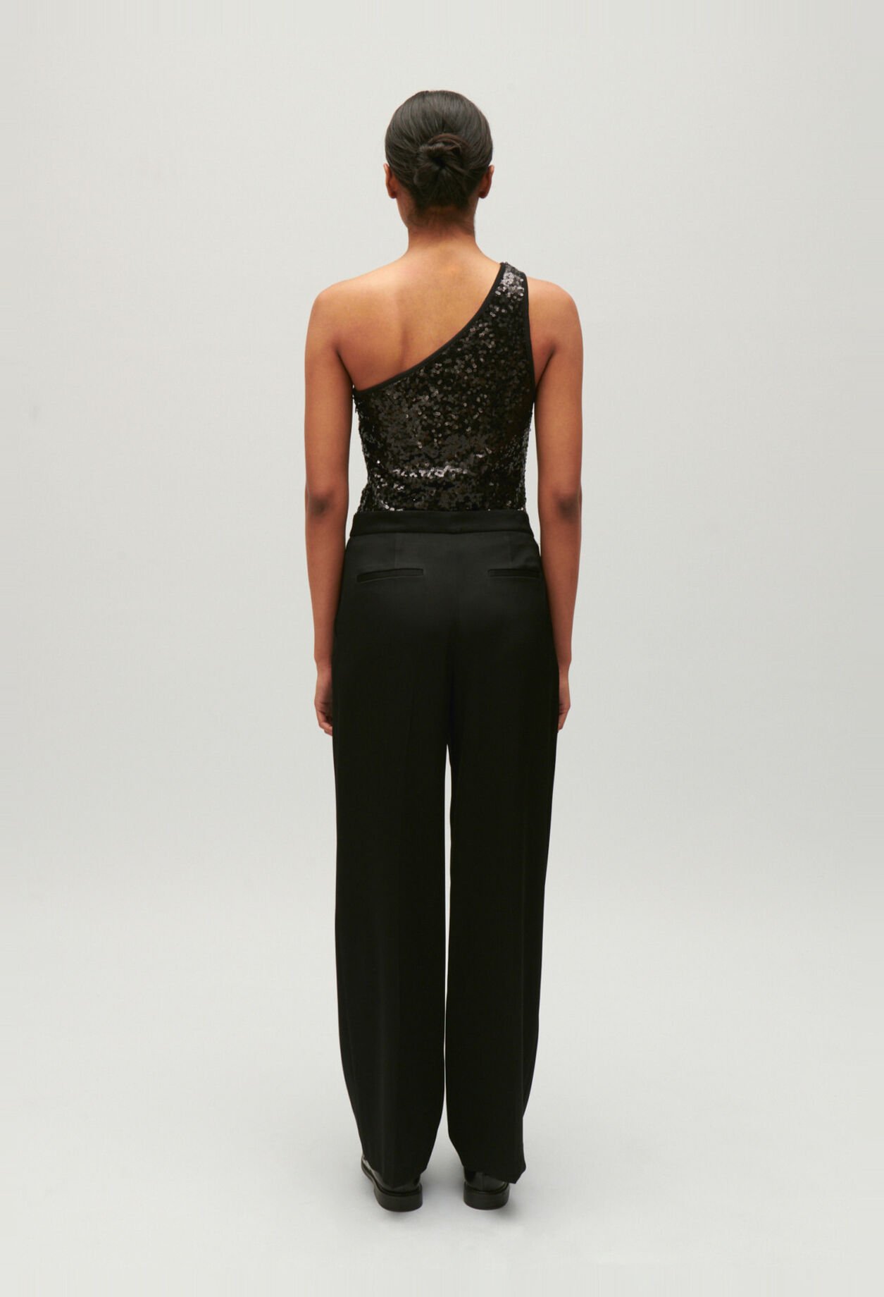 Black asymmetric bodysuit with sequins