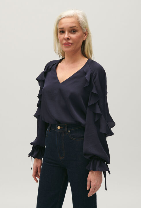 Navy blue ruffled blouse