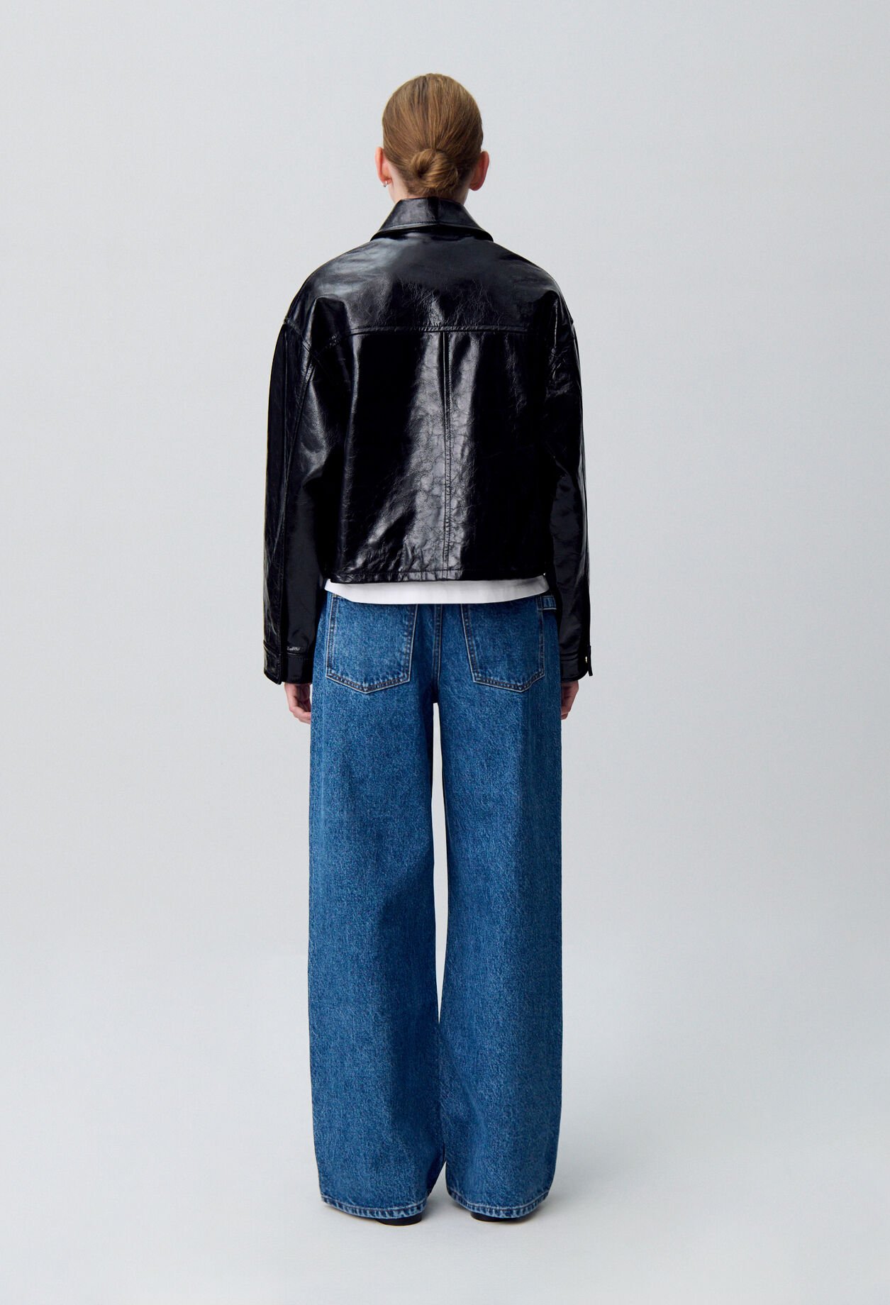 Aged patent leather jacket