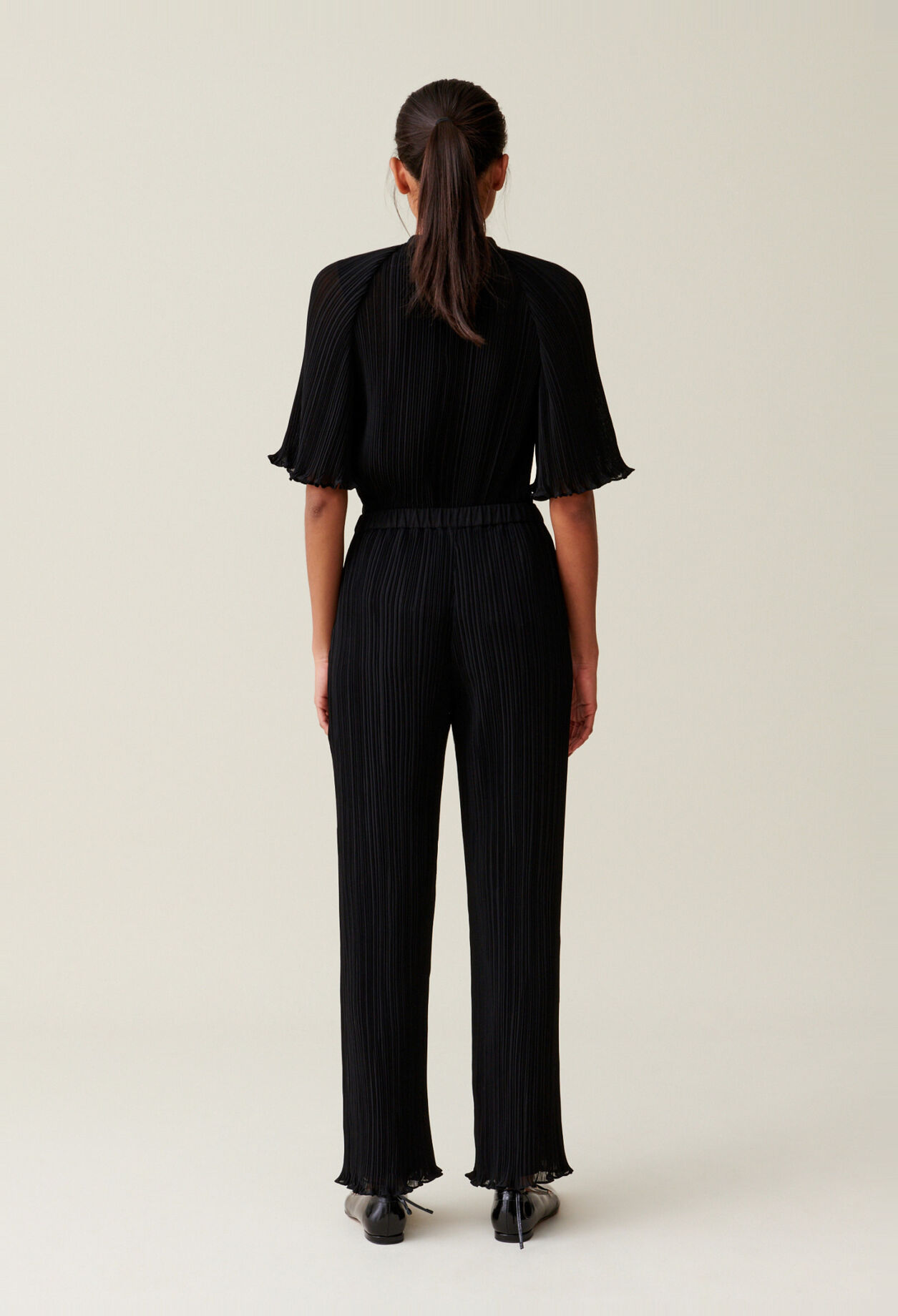 Pantalon fluide pliss&eacute; volant&eacute;
